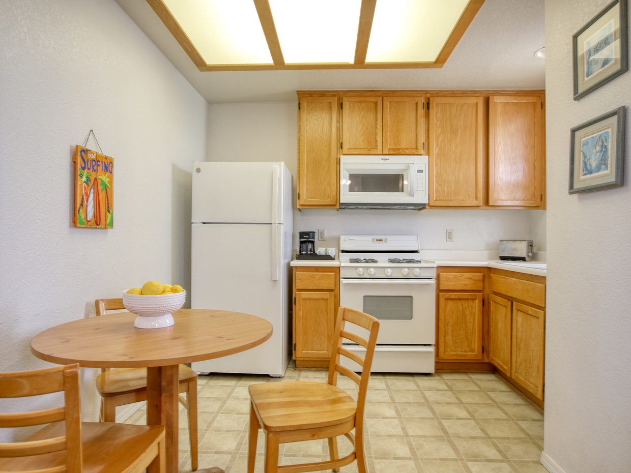 A cozy dining nook and ample storage for all of your kitchen needs! 