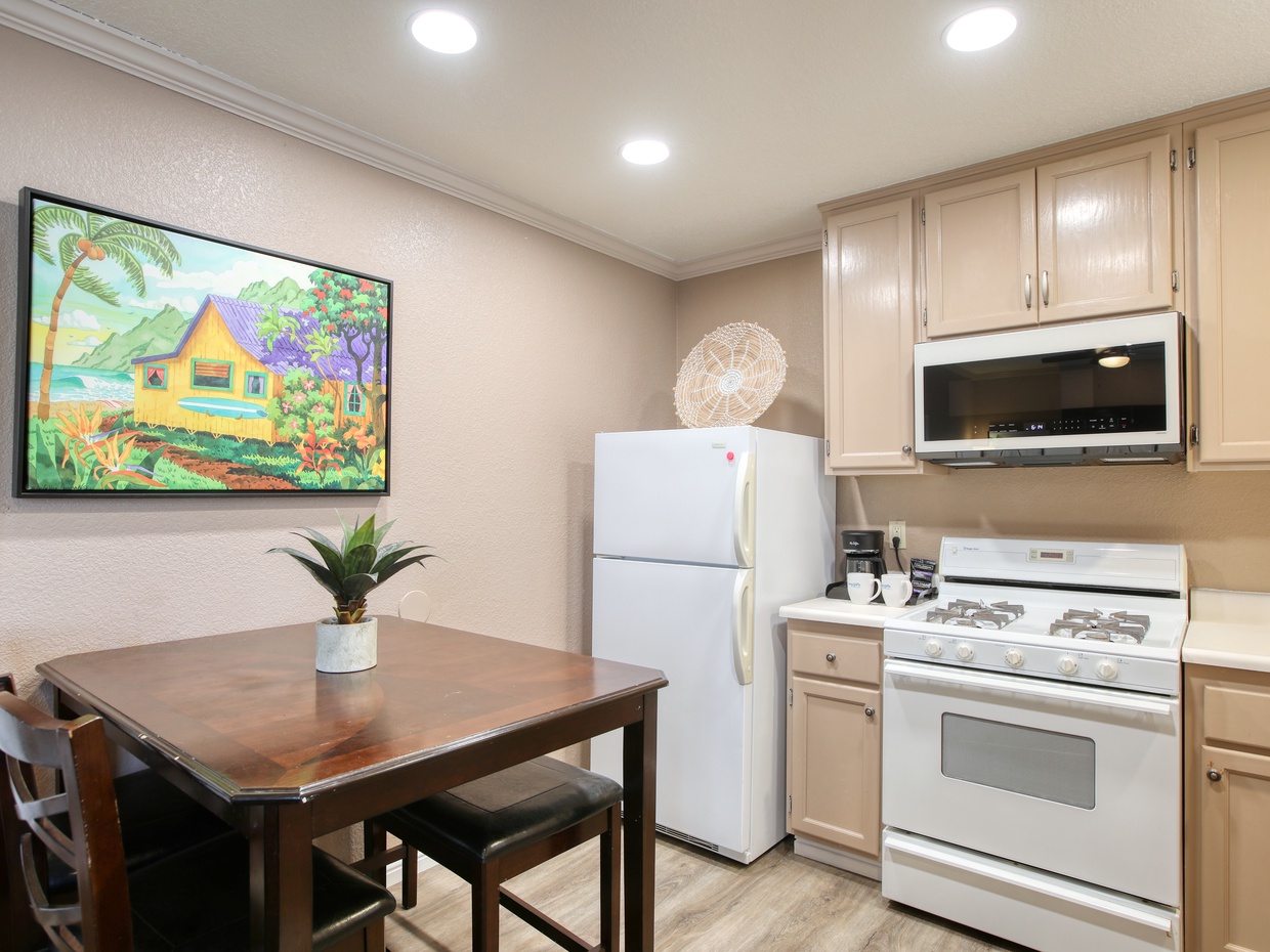 Welcome to your bright and breezy kitchen! Freshly updated with a crisp, clean coat of paint to match our coastal vibe, this full kitchen has everything you need to fuel your adventures. Coffee maker provided - one pack of coffee provided for "first morning". Guest to provide their fav ground coffee and tea. 
