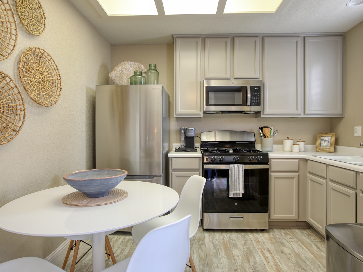 The fully equipped kitchen has a refrigerator, stove and oven, microwave, k-cup coffee maker, and dish ware—everything you need to whip up meals or enjoy a fresh cup of coffee before heading to the beach. 