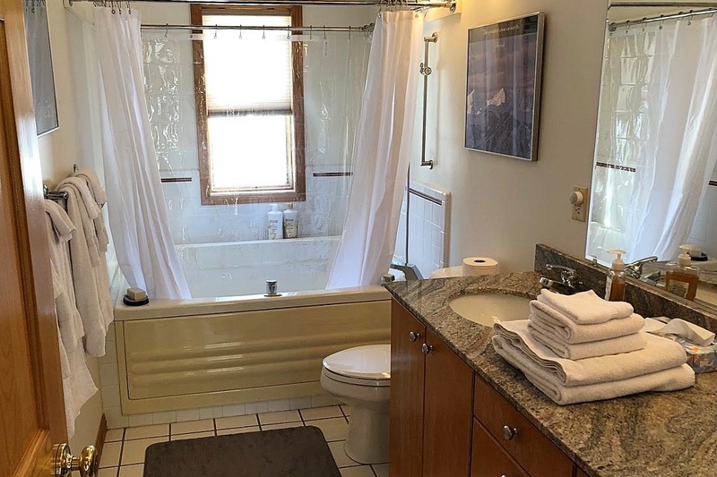 Upstairs Bathroom with Double Sinks and Large Jetted Tub