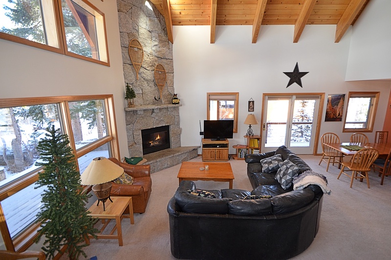 Open Living Room with Gorgeous Custom Stone Fireplace