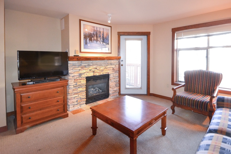 Living Room with TV, Gas Fireplace, Door to Deck