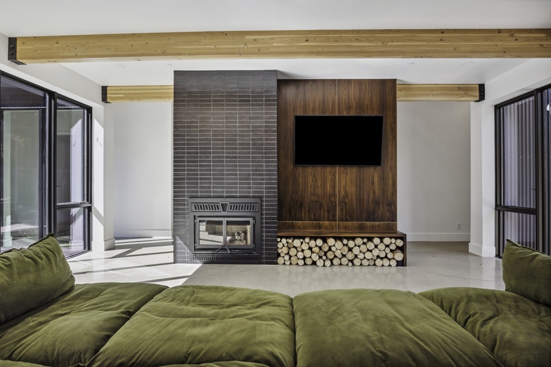 Living room wood-burning fireplace and smart TV