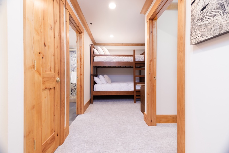 Bright hallway connects living area and bedrooms