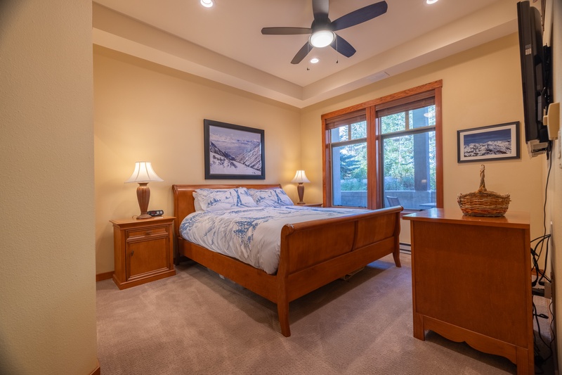 Large windows bring tons of natural light into the bedroom