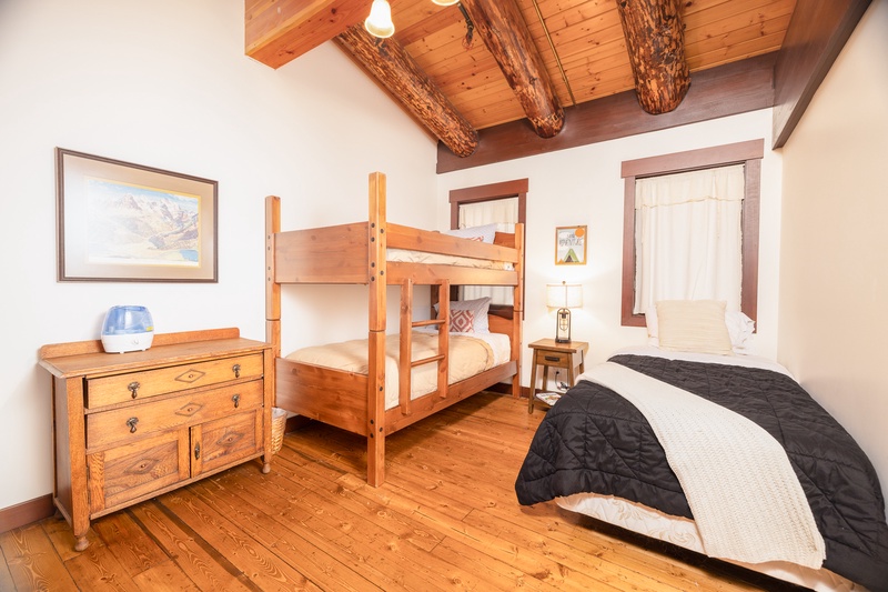 Bunk room with 3 single beds