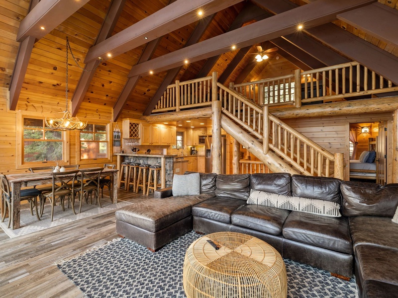 Alternate view of the main living area with open sight lines to kitchen and loft