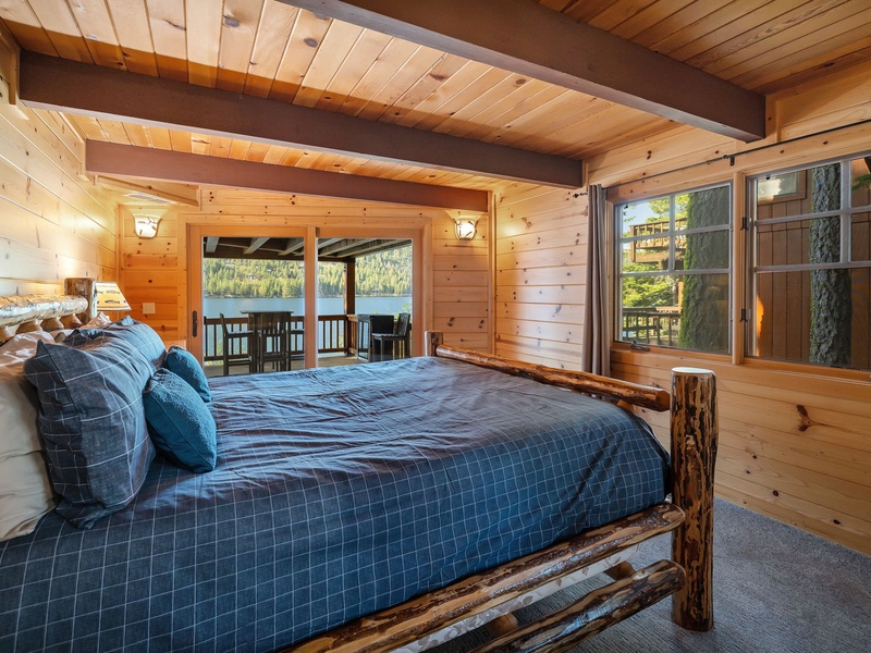 Second king bedroom with sliding glass doors that open to the covered deck