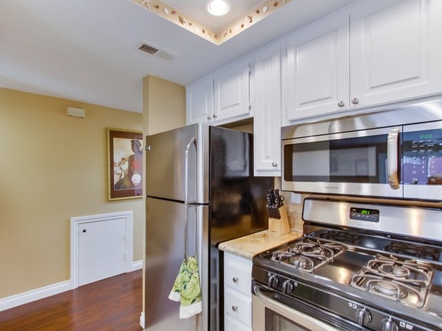Kitchen has stainless steel appliances.