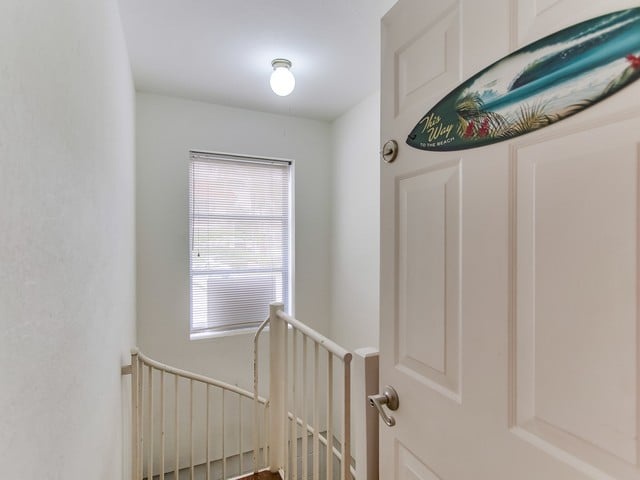 Spiral staircase down to the garage.