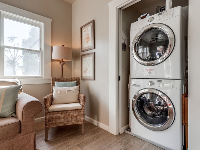 Washer and dryer in back living room.