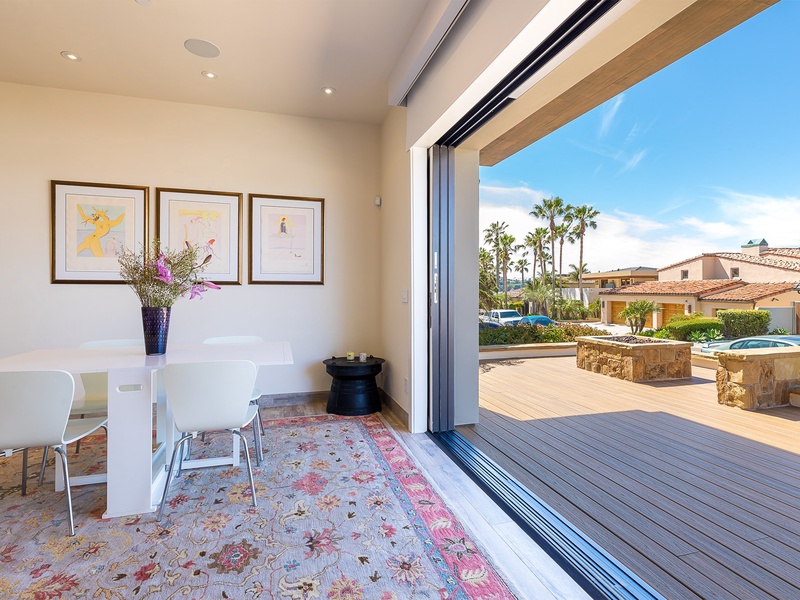 Accordion door opens the front of the house to the dining area.