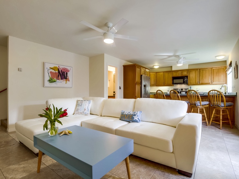 Open concept living room leads right into kitchen.