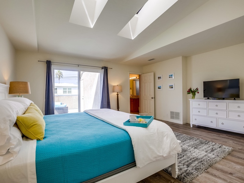 TV in master bedroom for entertainment.
