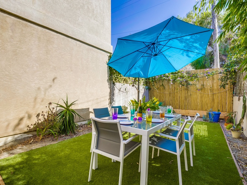 Side yard outdoor space near front door.