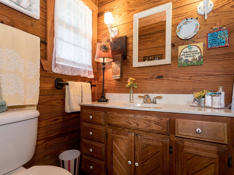 The downstairs bathroom includes a tub/shower