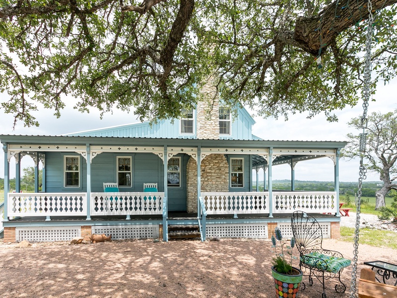 A lovely wraparound porch greets you upon arrival
