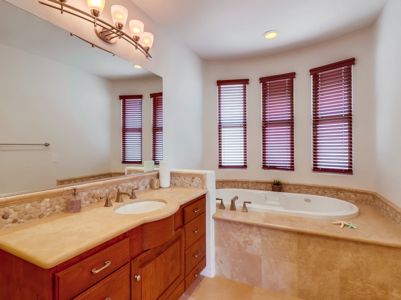 Large soaking tub in master bedroom en suite bathroom.