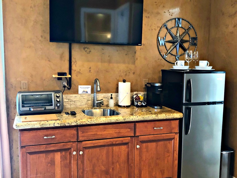 Downstairs guest suite with small kitchen area.