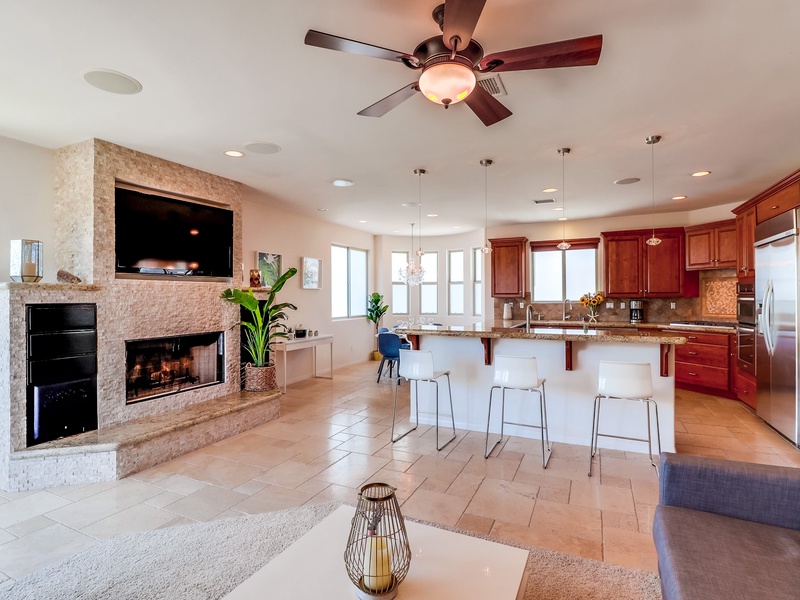 Great room with living room, dining room, and kitchen.