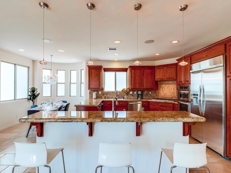 Bar seating at kitchen counter.