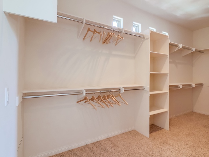 Large walk in closet in master bedroom.