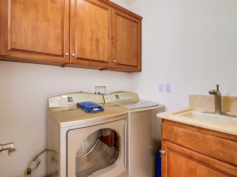 Laundry on first floor near garage door.