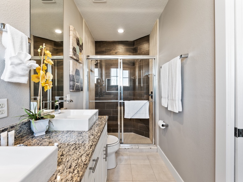 Our master bathroom features a double vanity,  bathtub and shower.