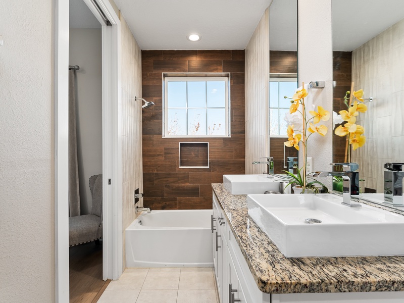 Our master bathroom features a double vanity,  bathtub and shower.