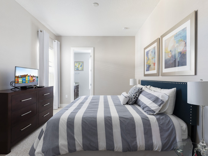 Each bedroom includes its own TV, closet space, and a private bathroom.