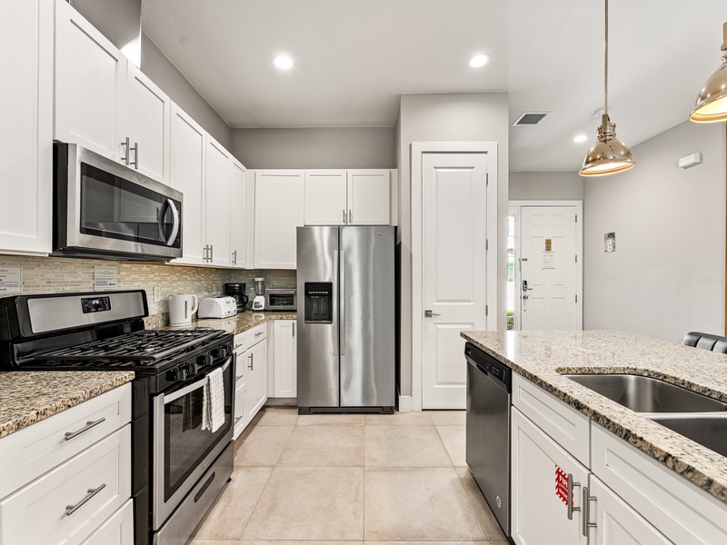Enjoy cooking with sleek stainless steel appliances in a fully equipped kitchen.