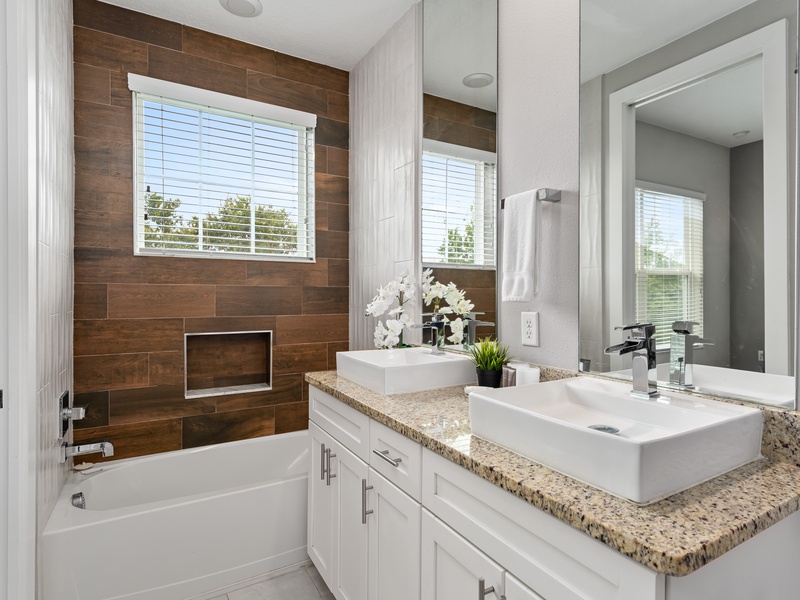 Relax after a long day with a soothing soak in the bathtub.