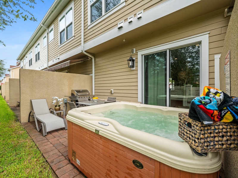 Unwind after a long day in the private patio hot tub, perfect for evening relaxation.