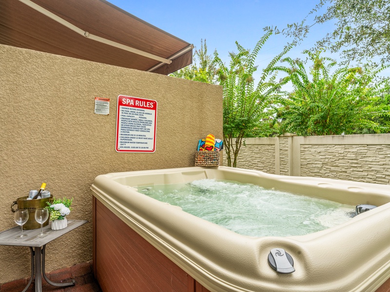 Unwind after a long day in the private patio hot tub, perfect for evening relaxation.