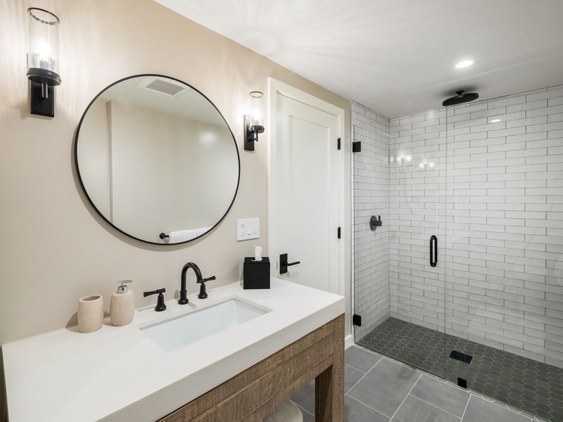 A remodeled ensuite featuring a stand-up glass shower