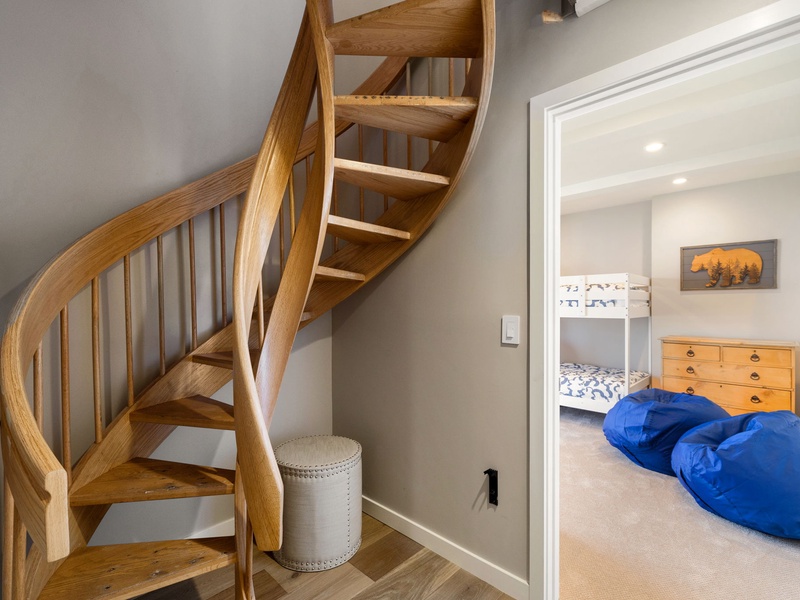 Spiral stairs lead down to the lower level of the home
