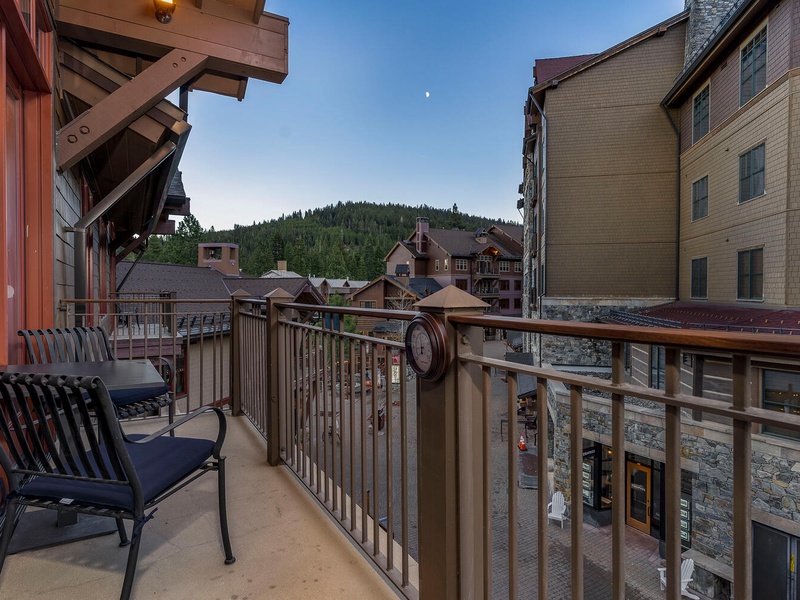 The balcony features village and mountain views
