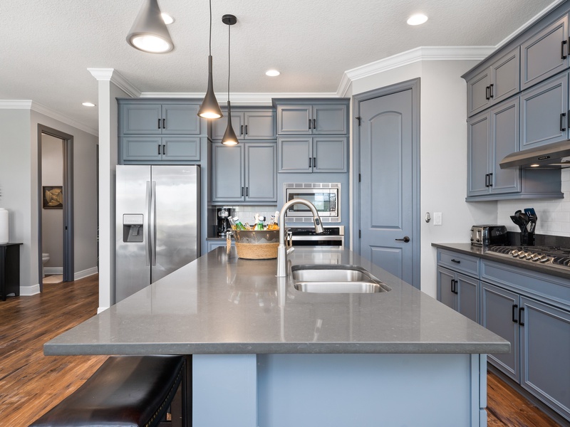 The kitchen features stainless steel appliances.