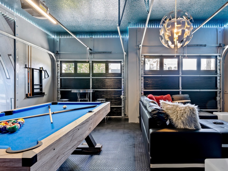 The game room features a game console, pool table and multiple board games.