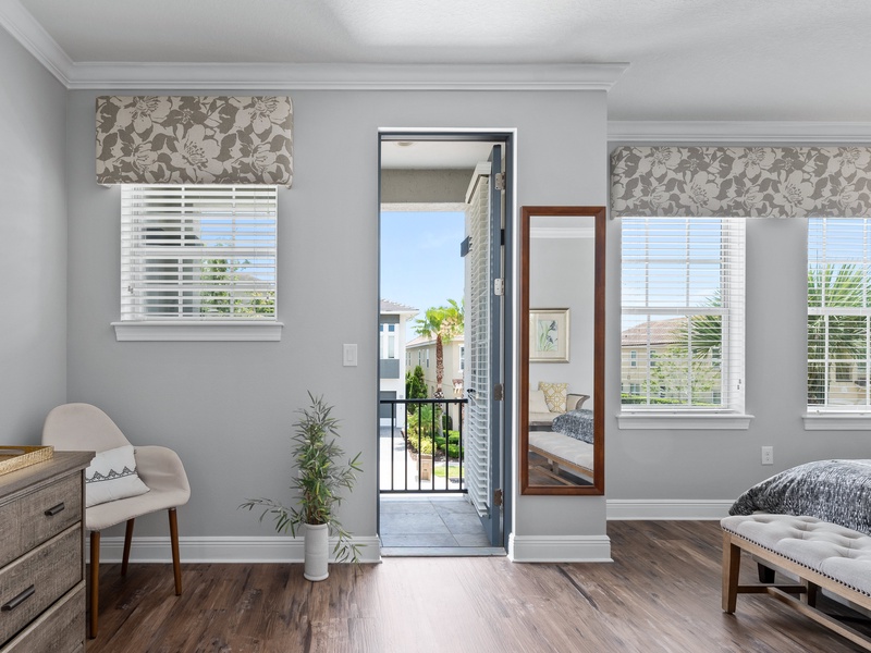 The master bedroom comes with access to a private balcony with views to the swimming pool.