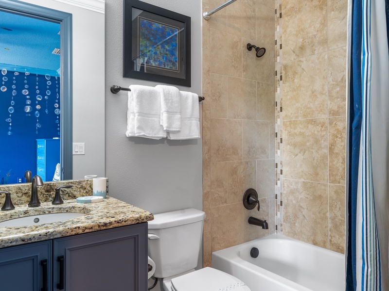 Private bathroom with bathtub.