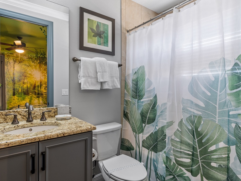 Private bathroom with bathtub.