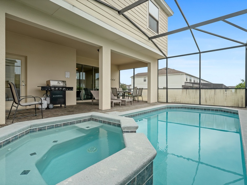 Our patio features a private pool, a BBQ grill, and a comfortable al fresco dining area to enjoy meals outdoors under the Florida sun.