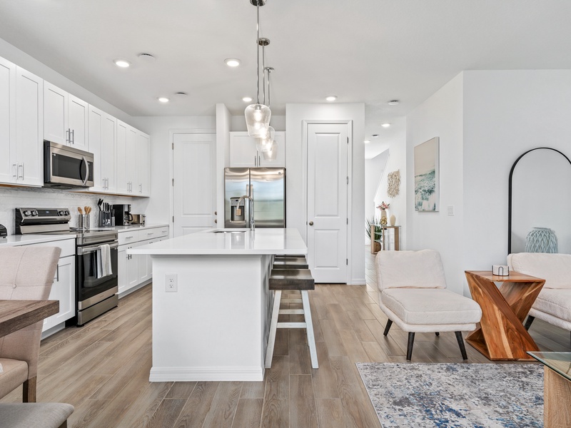 The living room, dining area and kitchen perfectly integrate into one ambience, ideal for socializing during the holidays.