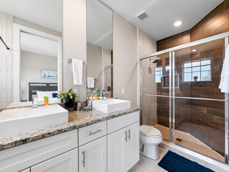 Our master bathroom comes with its own bathtub and separate shower for your convenience.