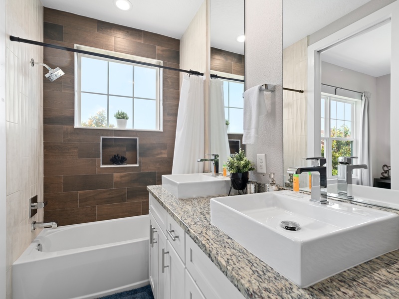 Our master bathroom comes with its own bathtub and separate shower for your convenience.