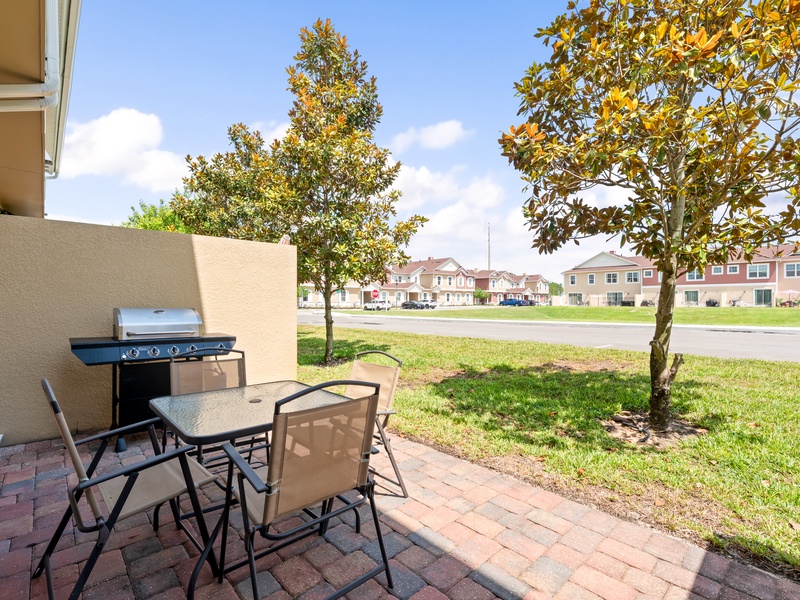Step outside to the open patio, complete with a BBQ grill, perfect for casual outdoor dining.