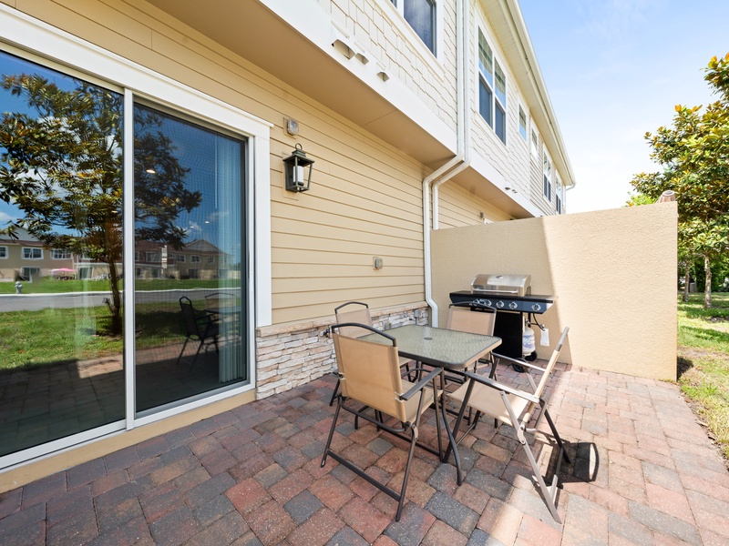 Step outside to the open patio, complete with a BBQ grill, perfect for casual outdoor dining.