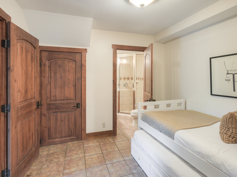 Sixth Bedroom (Level 1): Full/Double daybed with trundle and ensuite bath with walk-in shower