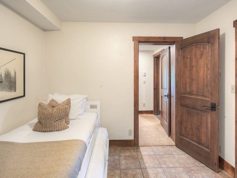 Sixth Bedroom (Level 1): Full/Double daybed with trundle and ensuite bath with walk-in shower